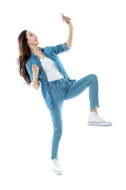 istock Woman taking a selfie on white background 1153889885