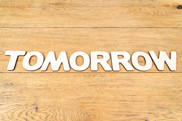 istock Word tomorrow on a wooden table 1153890815