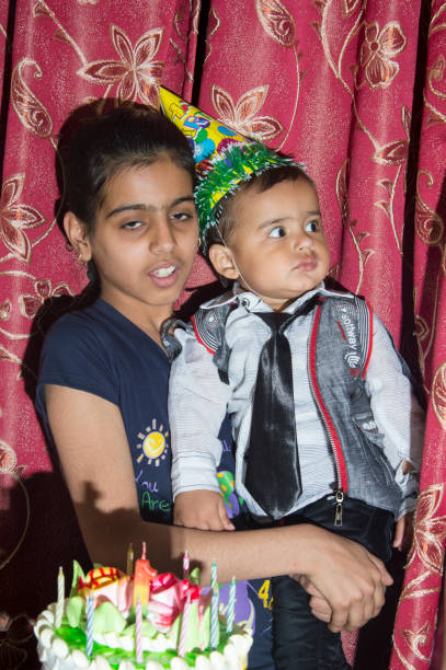 istock Siblings celebrating birthday together at home 1153893388