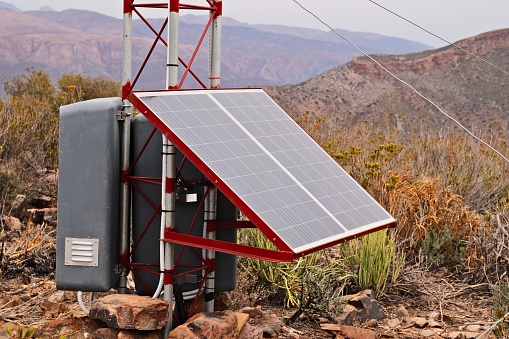 A solar power panel. This image can be used to represent the concept of renewable energy or living off the grid.