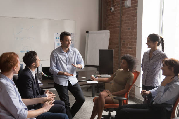 istock Diverse employees brainstorm sharing ideas at office meeting 1153894572