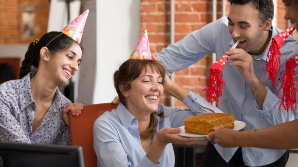 istock Excited diverse workers congratulate colleague with birthday in office 1153894600