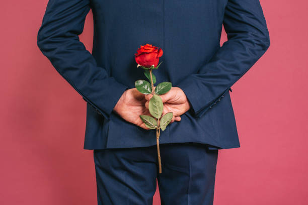 Man holding a rose stock photo