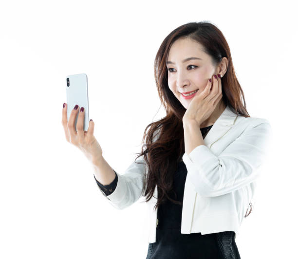 istock Businesswoman talking selfie on white background 1153896578