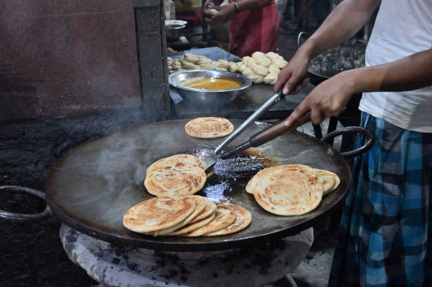 Lachcha parathas are being prepared road side stock photo