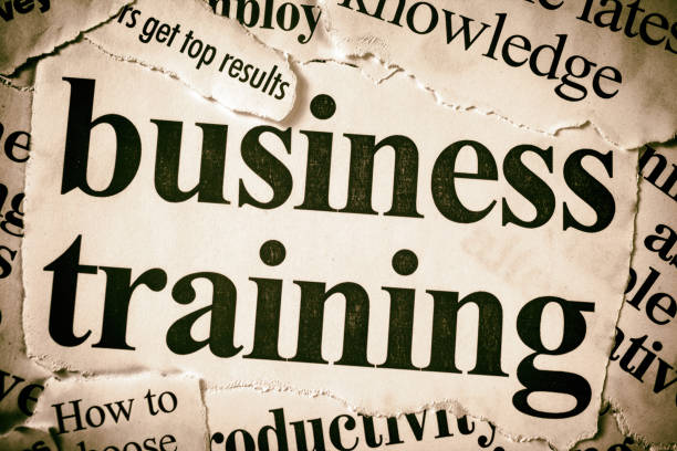 istock Newspaper headlines about benefits of business training 1153899633