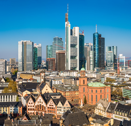 Aerial view across Frankfurt’s dynamic skyline, from the historic landmarks of the Old Town to the futuristic spires of the banking skyscrapers, Hesse, Germany.