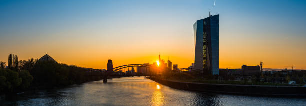 istock Frankfurt banking skyscapers overlooking Main silhouetted at sunset panorama Germany 1153900873
