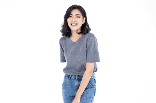 istock Young beautiful Asian laughing against over white background. 1153901229
