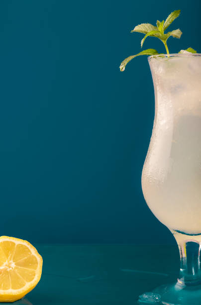 istock Refreshing lemonade drink against a blue background 1153907267