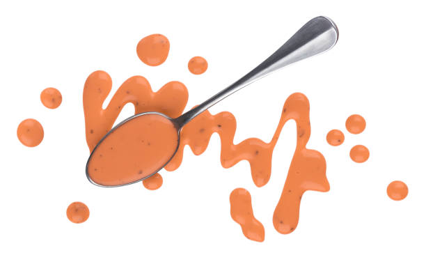 Pink cocktail sauce isolated on white background, top view, spoon of thousand island sauce Pink cocktail sauce isolated on white background, for shrimps or fish, top view, spoon of thousand island sauce ketchup-splash stock pictures, royalty-free photos & images