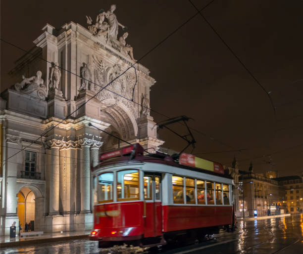 istock Red tram in Lisbon at night 1153914142