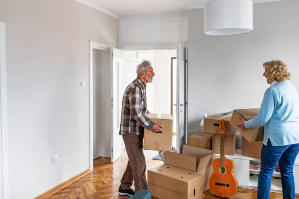 istock Couple with Moving Boxes in New Home 1153914225
