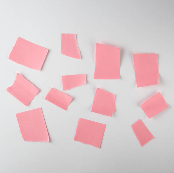 istock empty torn pieces of pink paper on a white background 1153915247