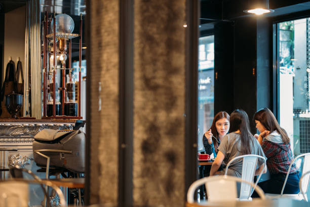 istock Coffee time with girlfriends in cafe 1153915282