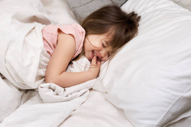 istock Cute little child girl sleeping 1153918422