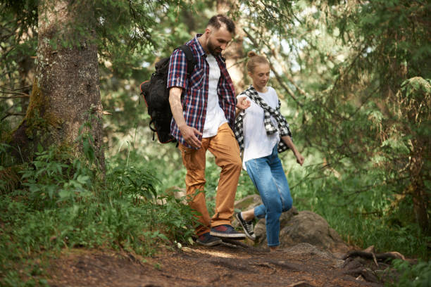 istock Couple hiking in the forest 1153921238
