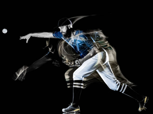 istock baseball player man isolated black background light painting 1153922284