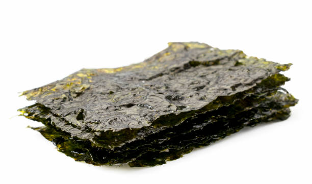 istock Seaweed chips close-up on a white. Isolated. 1153922299