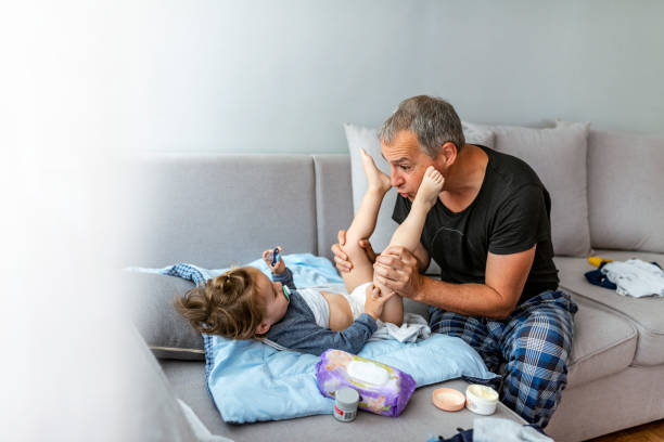 istock Father playing with his dauther on the sofa 1153922311