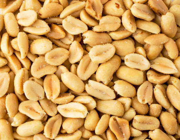 istock Salted peanuts background. The form of top. 1153922321