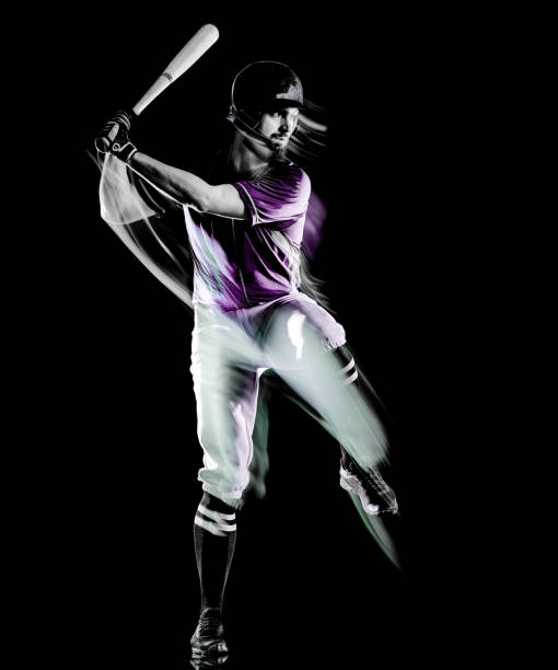 istock baseball player man isolated black background light painting 1153922343