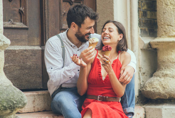 istock Happy couple having date and eating ice cream 1153923474