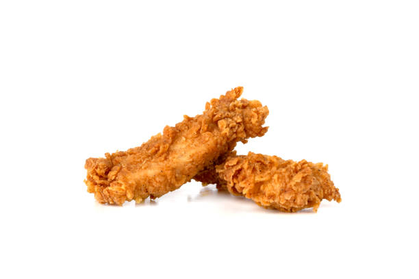istock Fried chicken fillets on a white background. Fried chicken nuggets close-up. 1153924629