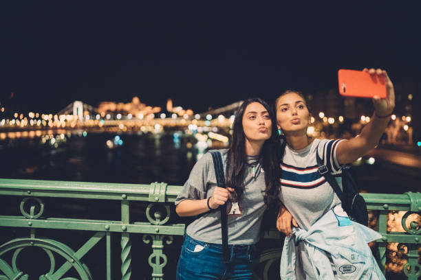 istock Girls taking selfie in Budapest 1153927371