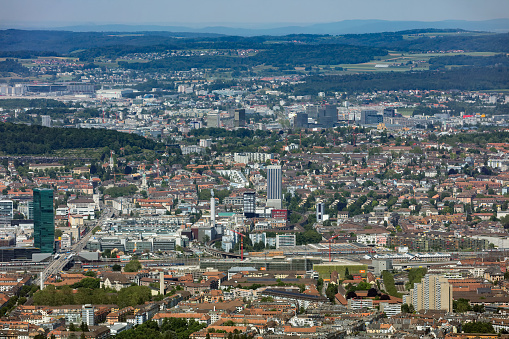Zurich, Switzerland - June 5, 2019: the city of Zurich as seen from Mt. Uetliberg. The Uetliberg is a mountain rising to 870 m and offering a panoramic view of the entire city of Zurich, which is the largest city in Switzerland and the capital of the Swiss canton of Zurich.
