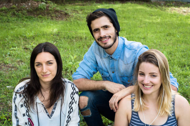 istock Group of  Group  of students relaxing in School Campus. 1153927514
