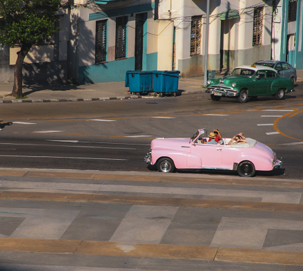 exotic and unique old pink car and street in Havana, Cuba