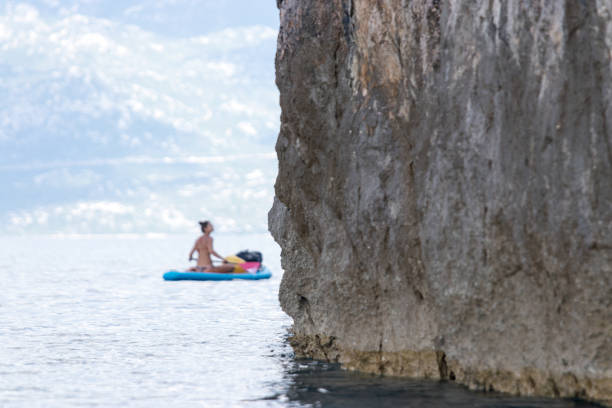 istock Woman paddling around the corner 1153928872
