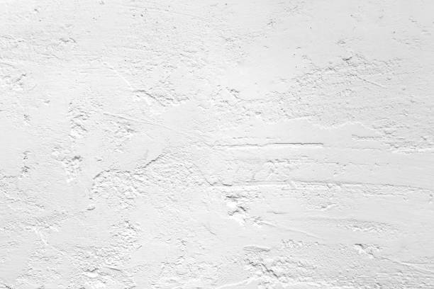 istock white colored low contrast Concrete textured background with roughness and irregularities 1153931193