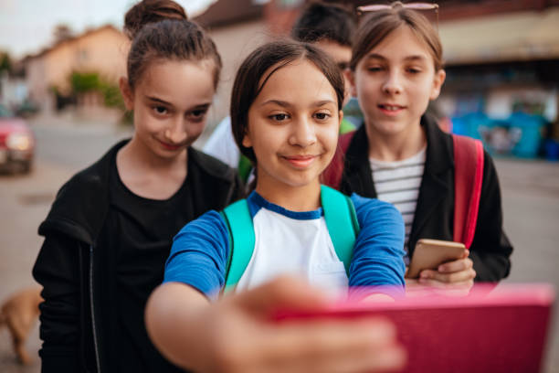 istock Girlfriends making selfie on the street 1153934327