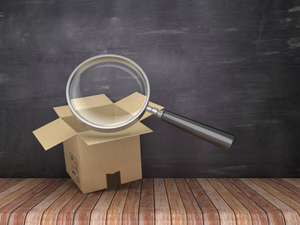 istock Magnifying Glass with Cardboard Box on Chalkboard Background - 3D Rendering 1153939686