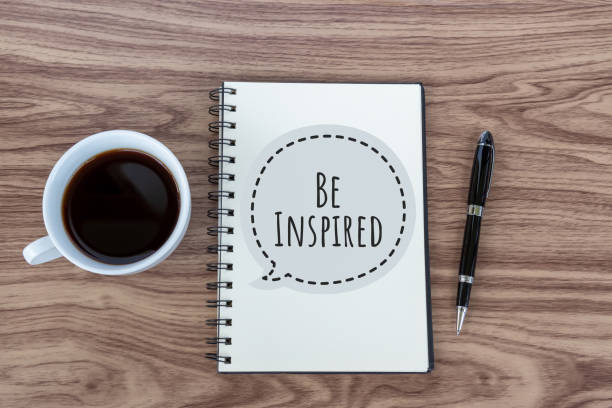 istock Be inspired quote on notebook with cup of coffee 1153939813