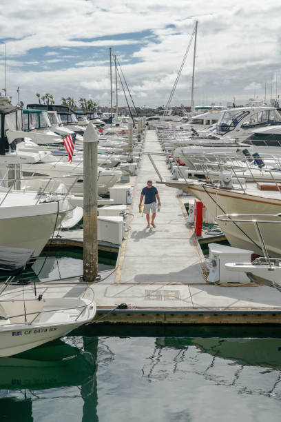 Boats moored at Embarcadero Marina Park North, San Diego Boats moored at Embarcadero Marina Park North, San Diego. Boat, yachts, ship & sail docked at the harbor. Marina with anchored luxury boats. California. USA. real estate outdoors vertical usa stock pictures, royalty-free photos & images