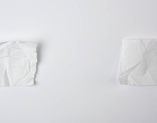 istock crumpled empty torn pieces of white paper on a white background 1153941578