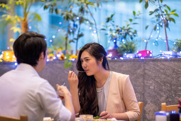 istock Young man and woman eating differ after work 1153945447
