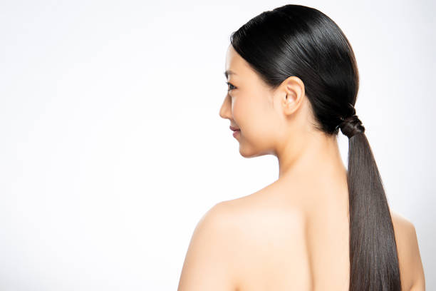 istock Asian woman turn back on white background, 1153951019