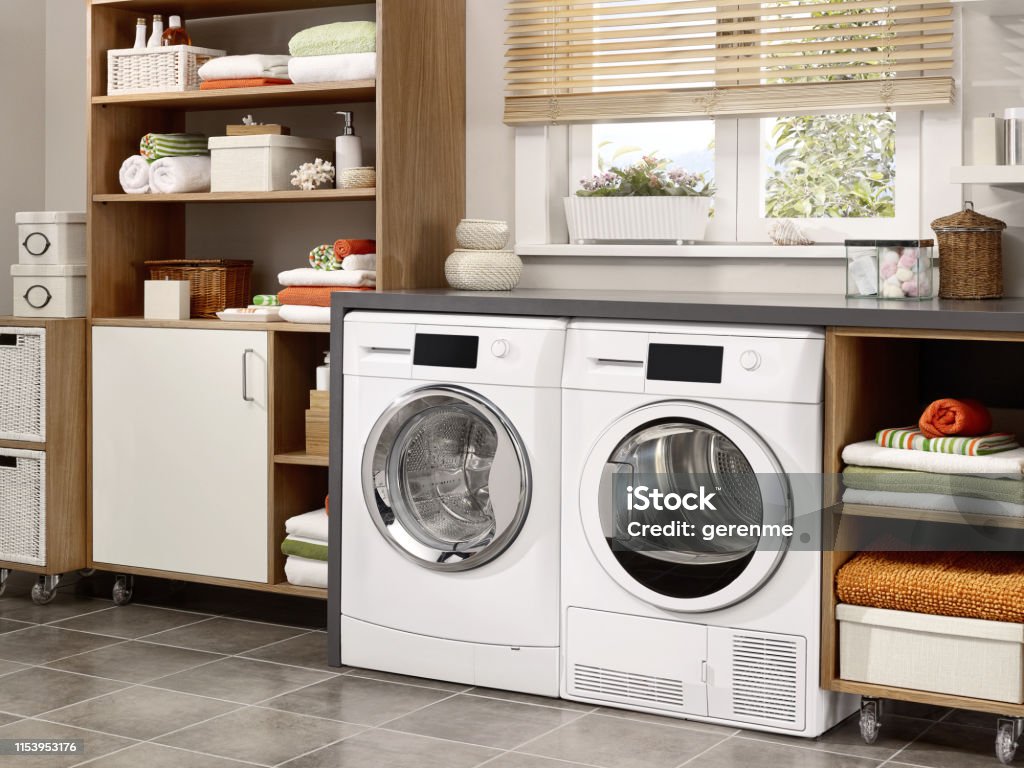 laundry room Domestic laundry room with washing machine and dryer Utility Room Stock Photo