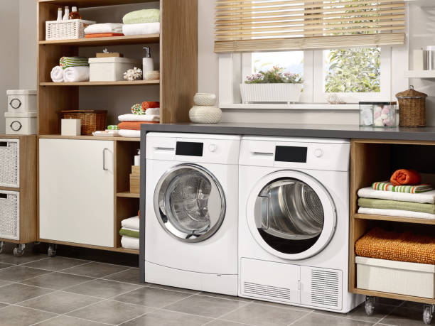 laundry room Domestic laundry room with washing machine and dryer dryer stock pictures, royalty-free photos & images