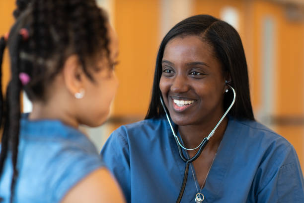 istock Female pediatrician with patient 1153954388