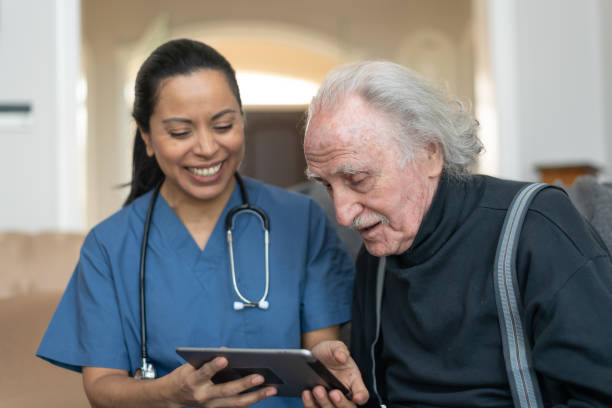 istock Elderly Gentleman With Nurse During Home Care Visit 1153954470