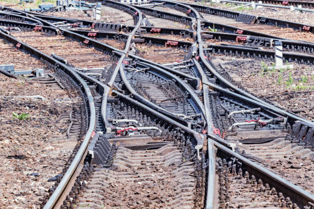 railway tracks on the big station at day time. - railroad spikes imagens e fotografias de stock