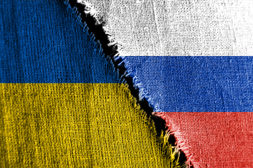 La brecha entre las dos banderas, Rusia y Ucrania, como un concepto de confrontación política. photo