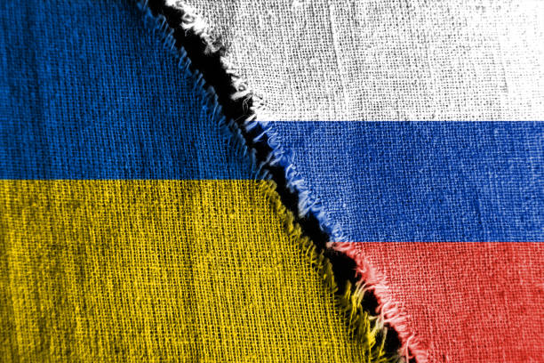the gap between the two flags, russia and ukraine, as a concept of political confrontation. - guerra imagens e fotografias de stock