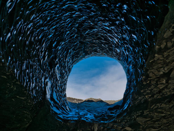 istock Hole in the crystal cave at the blue glacier 1153966711