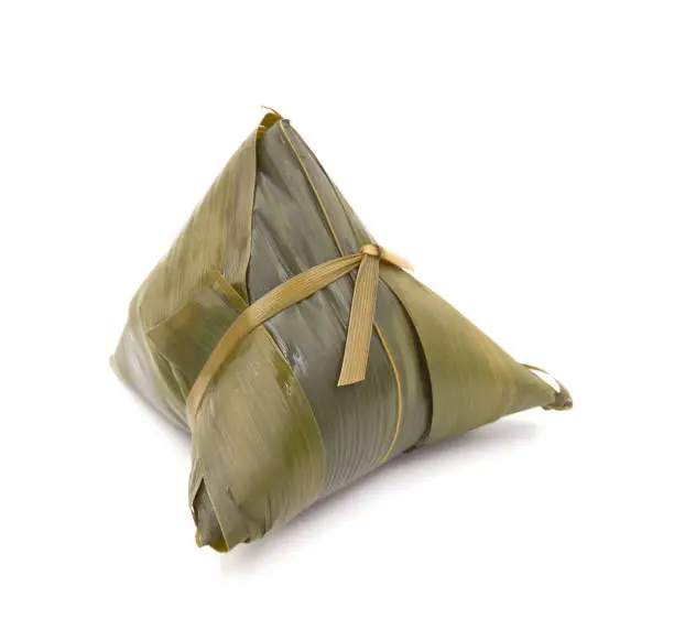 Photo of traditional wrapped rice dumplings  isolated on white background.